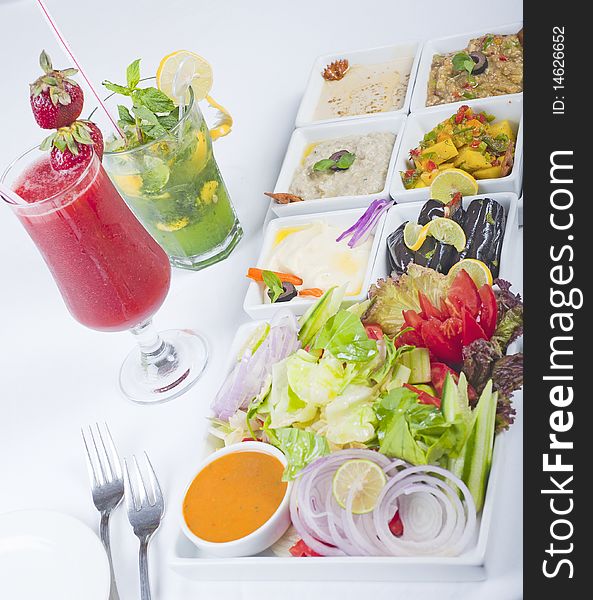 Selection of fresh salad dishes in bowls on a table in a restaurant. Selection of fresh salad dishes in bowls on a table in a restaurant