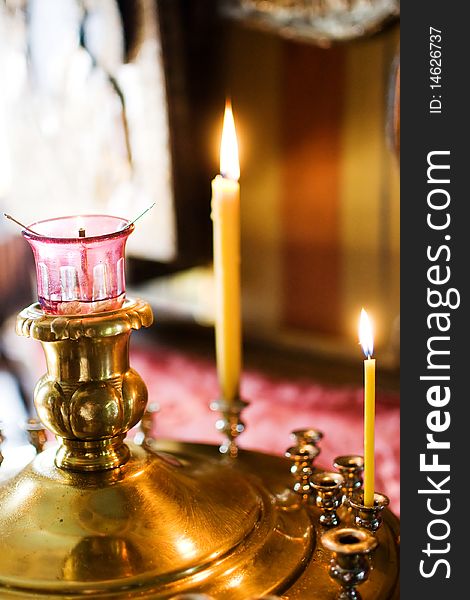 Two burning candles in an orthodox church. Two burning candles in an orthodox church