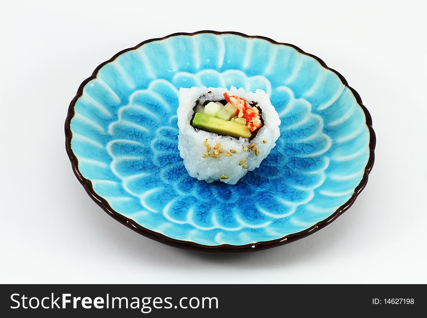 Fresh sushi on a traditional blue oriental plate. Fresh sushi on a traditional blue oriental plate.