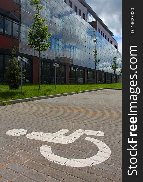 Parking space reserved for disabled in front of office building