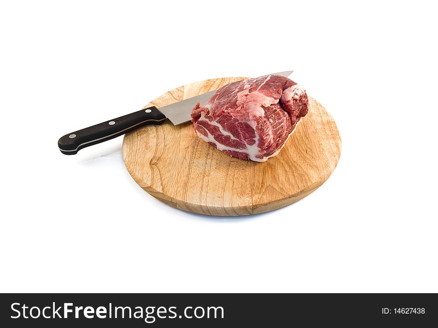 The piece of raw meat is isolated on a white background