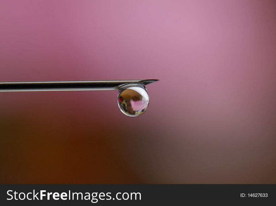 Closeup needle and drop water, nature and medical