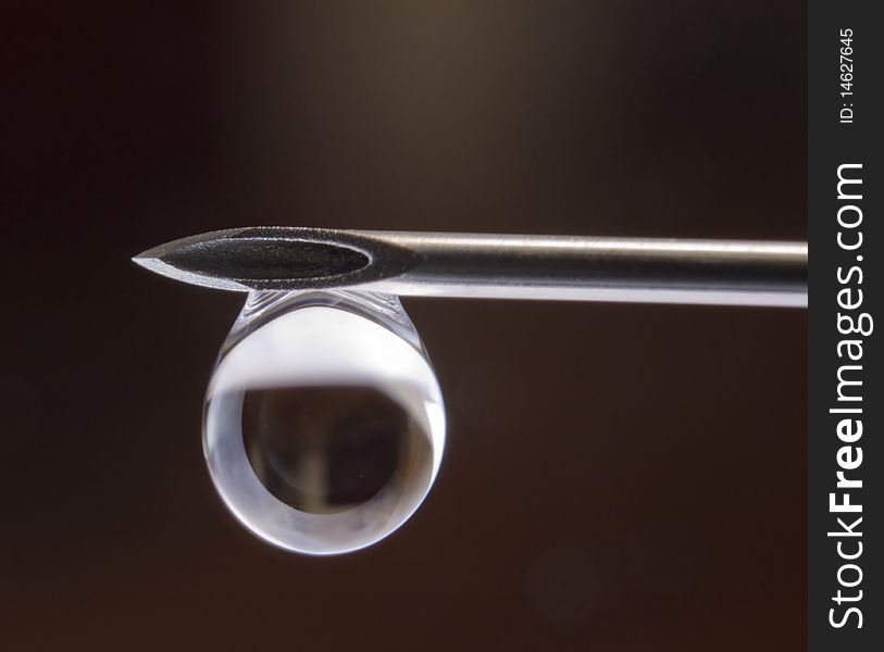 Closeup needle and drop water, nature and medical