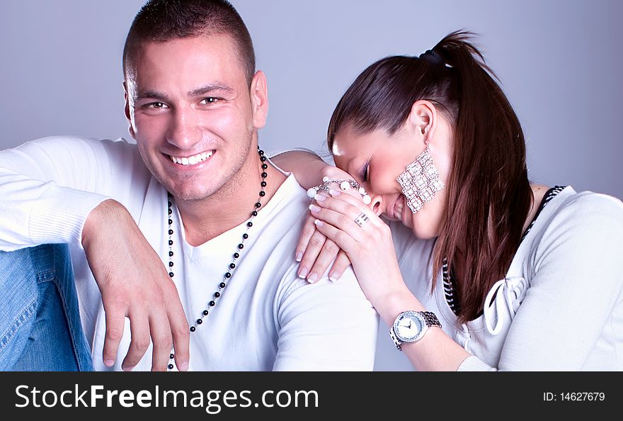 Young love couple smiling, studio shot