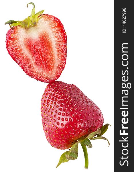 Two halves of sliced strawberry macro shot isolated over white background