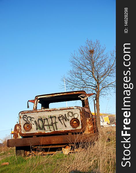 Vintage truck abandoned and rusting away in the fields. Vintage truck abandoned and rusting away in the fields