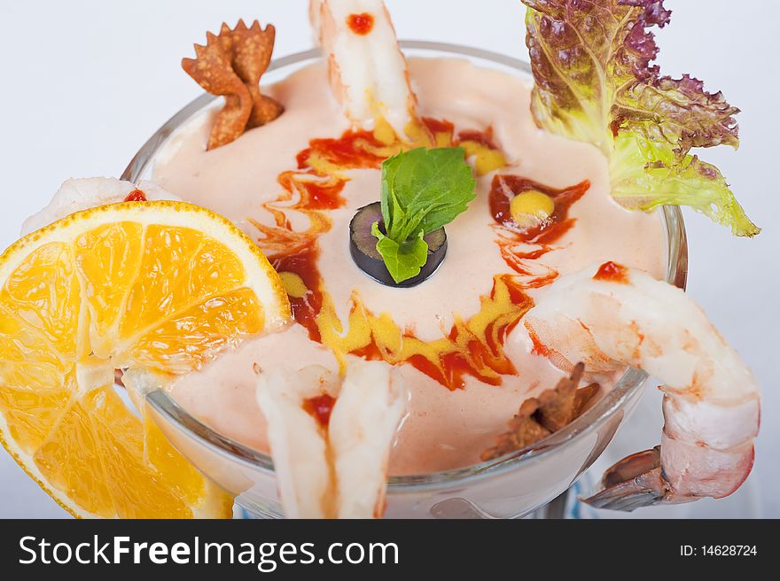 A la carte shrimp cocktail in a glass bowl closeup detail
