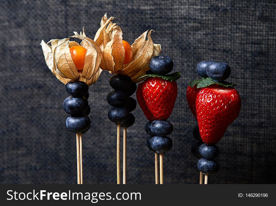 Blueberries, strawberries, blackberries fly in different directions. Blueberries, strawberries, blackberries fly in different directions