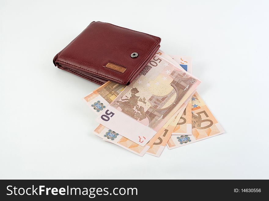 Banknotes falling from the wallet located on a white background. Banknotes falling from the wallet located on a white background
