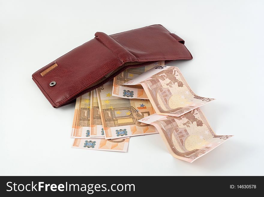 Banknotes falling from the wallet located on a white background. Banknotes falling from the wallet located on a white background