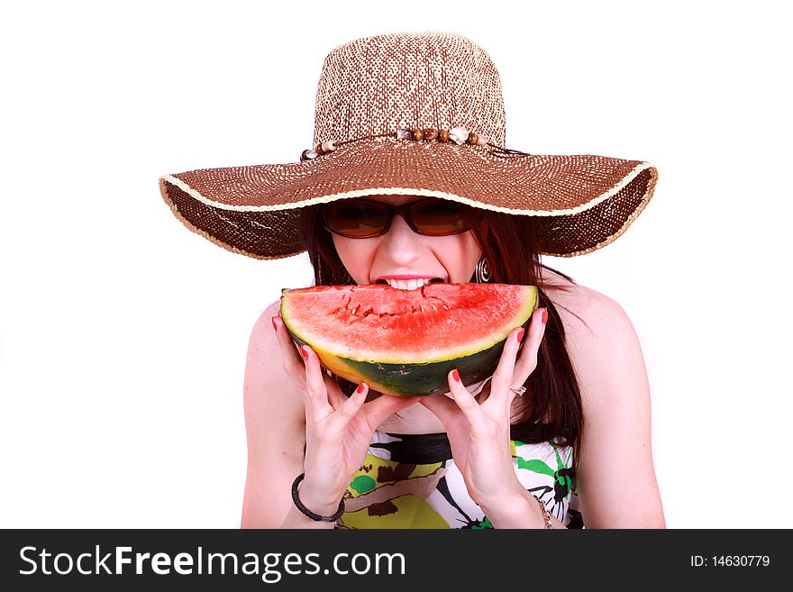 A beautiful woman wearing a hat and sunglasses, enjoying a sweet watermelon. A beautiful woman wearing a hat and sunglasses, enjoying a sweet watermelon.