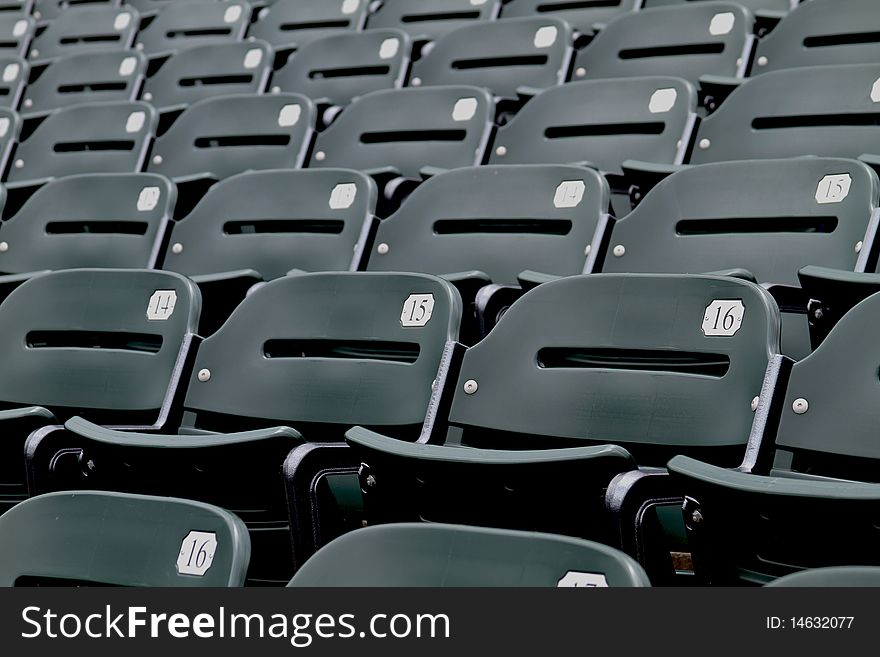 green stadium seating at sporting event.