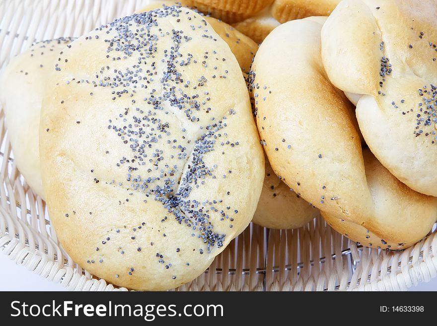 Bread rolls in a basket, isolated on white background. Bread rolls in a basket, isolated on white background.