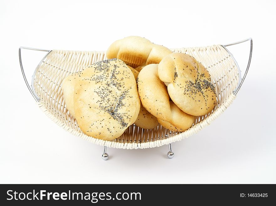 Bread rolls in a basket, isolated on white background. Bread rolls in a basket, isolated on white background.