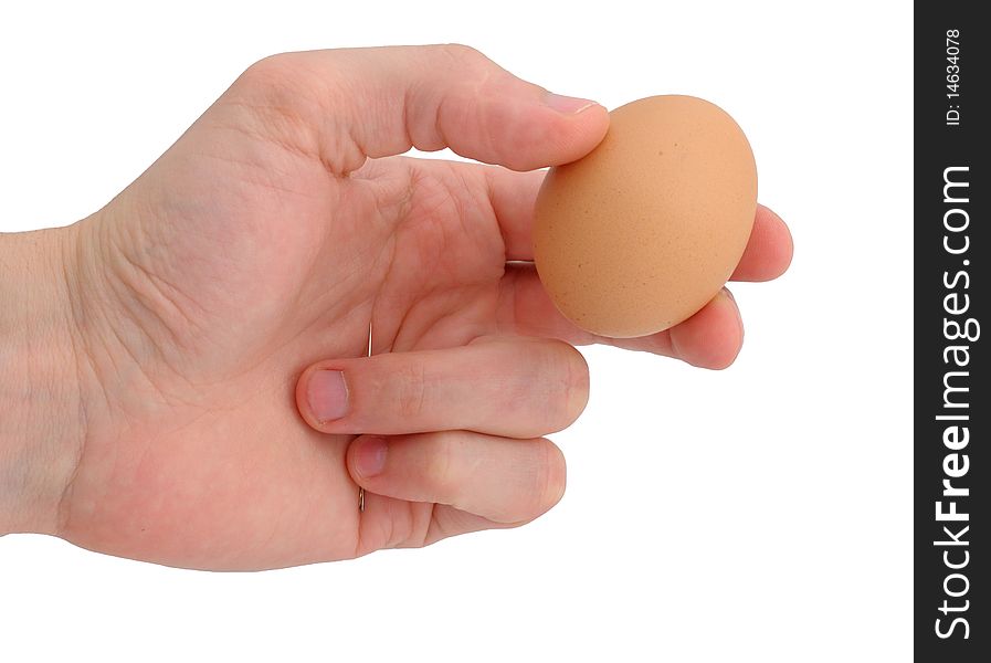 Man hand holding egg and needle. Man hand holding egg and needle