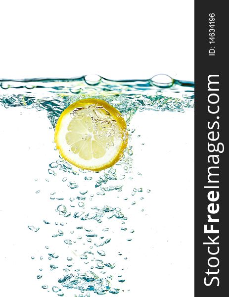 Fresh lemon splashing water isolated on white. Fresh lemon splashing water isolated on white