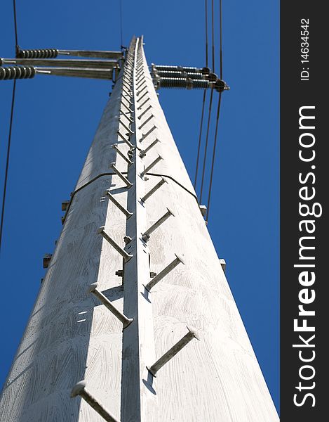 Looking up at a high voltage power pole. Looking up at a high voltage power pole.