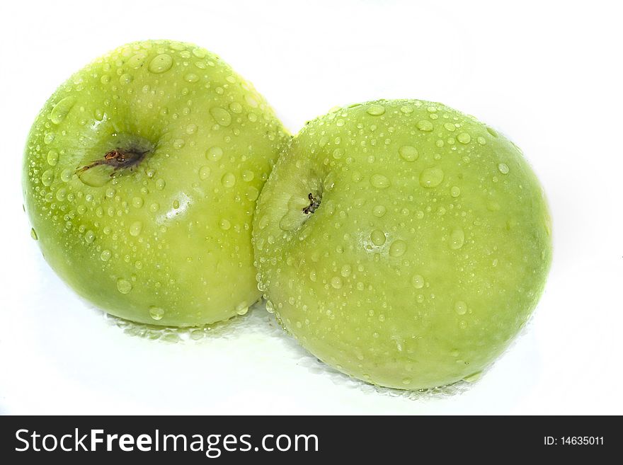 Two green apples isolated on a white background