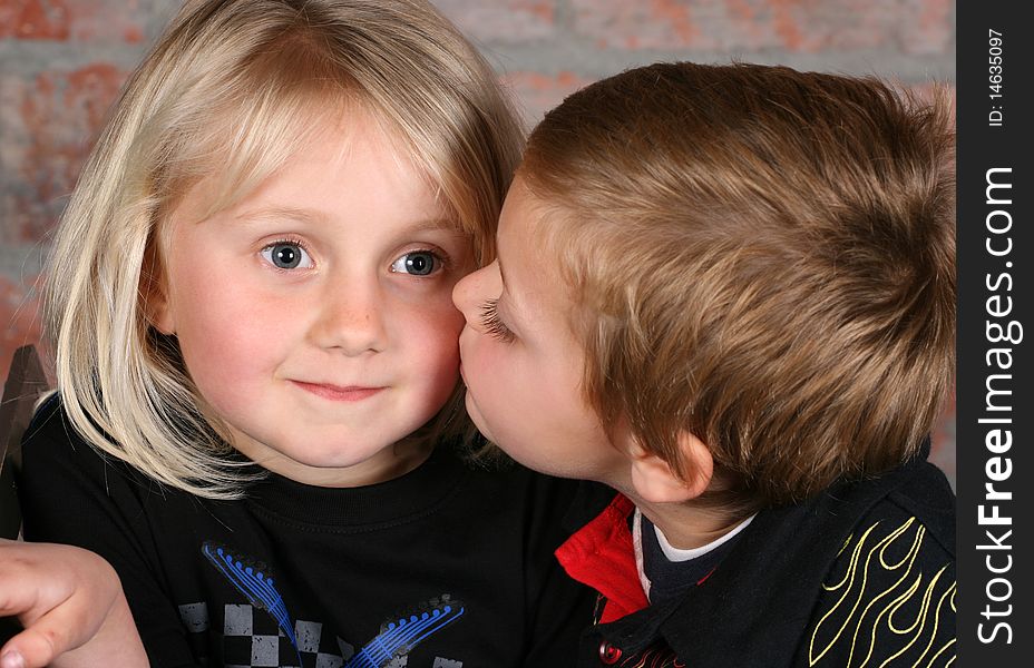 Beautiful young girl with blond hair and her cute boy friend. Beautiful young girl with blond hair and her cute boy friend