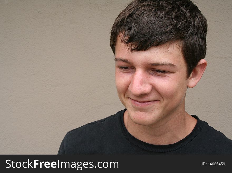 Head shot of a young man grinning,. Head shot of a young man grinning,