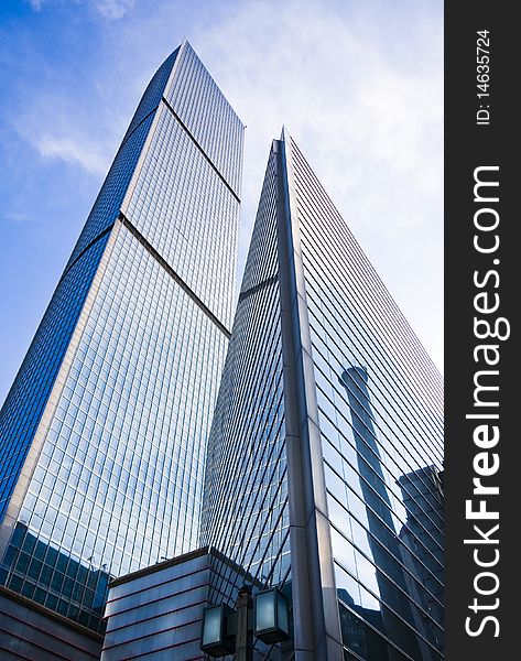 Highrise glass building with sky and clouds reflection. Highrise glass building with sky and clouds reflection