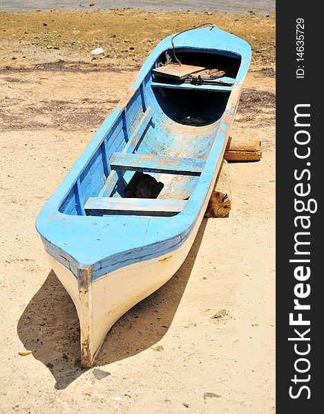 Blue Canoe On Beach