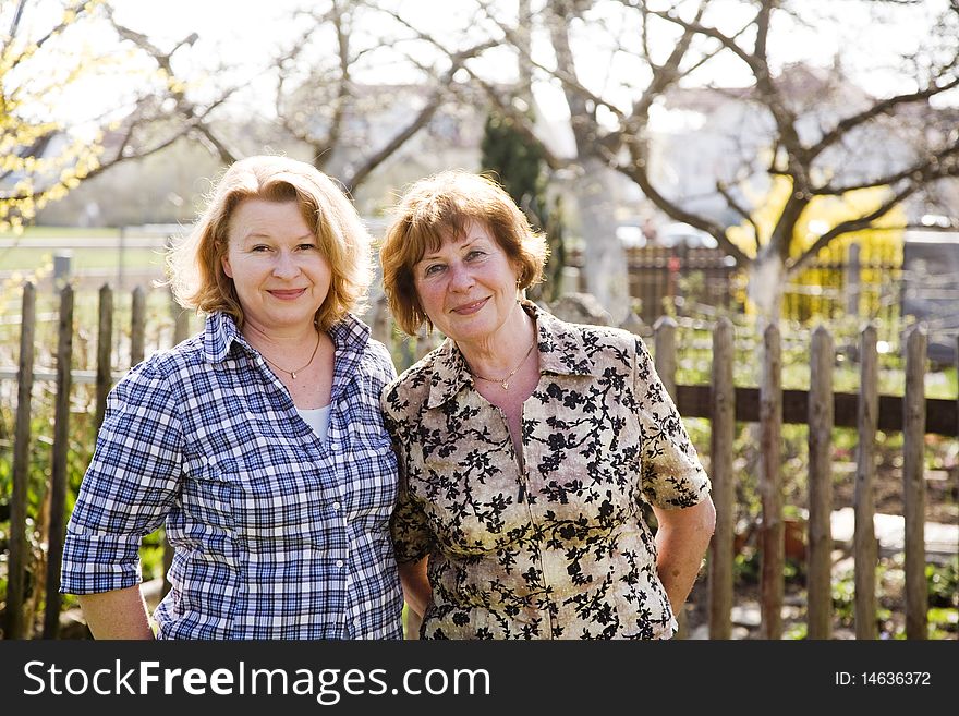 Mother and daughter, red haired looking confident and happy