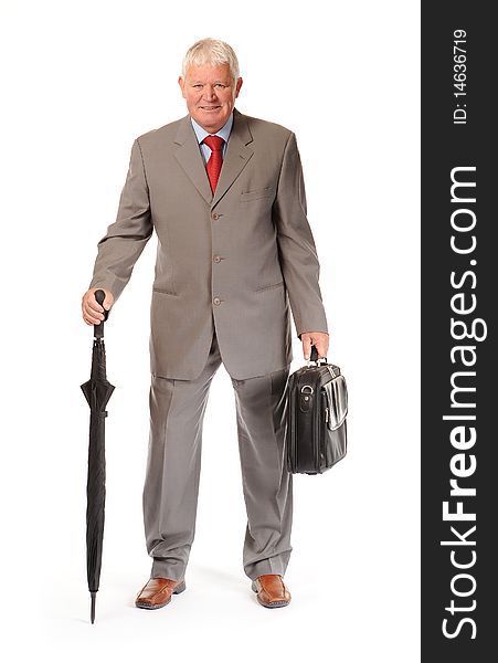 Successful mature business man on white background, with umbrella and briefcase. Successful mature business man on white background, with umbrella and briefcase