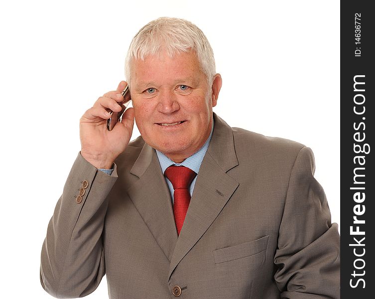 Successful mature business man on white background, using a cellphone or mobile. Successful mature business man on white background, using a cellphone or mobile