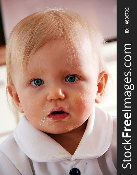 Nice little face of an caucasian baby eating. Nice little face of an caucasian baby eating