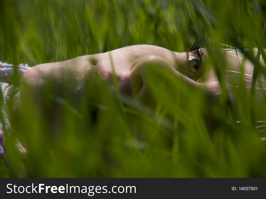 Portrait of the girl. In the spring on the nature in a grass. Portrait of the girl. In the spring on the nature in a grass.