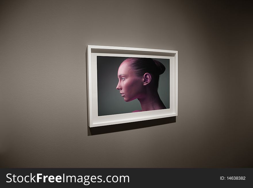 View of a frame with the photo of a beautiful woman. View of a frame with the photo of a beautiful woman