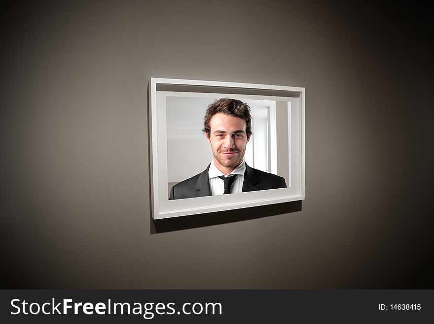 Frame containing a photo of a businessman. Frame containing a photo of a businessman
