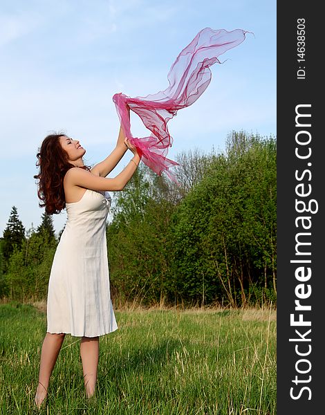 Girl dances with a scarf on nature. Girl dances with a scarf on nature