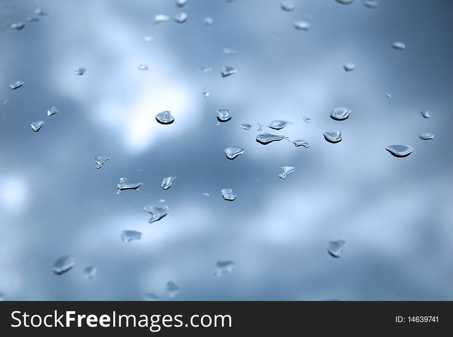 Attractive blue background; pane with drops. Attractive blue background; pane with drops