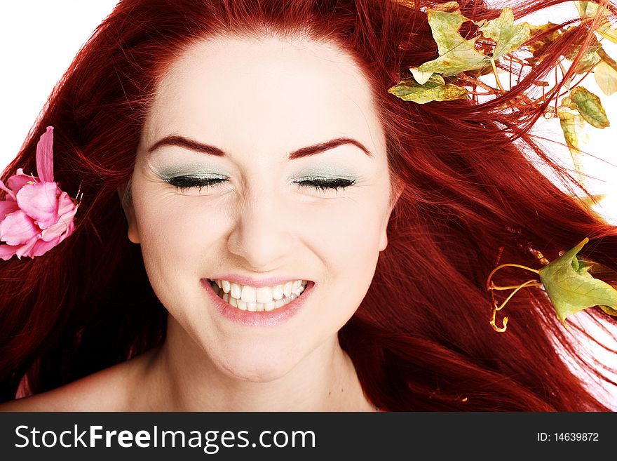 A beautiful young woman with flowers in her hair. A beautiful young woman with flowers in her hair.