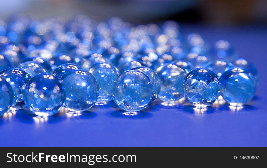 Clear crystal marbles with blue reflection. Clear crystal marbles with blue reflection