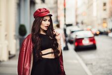 Free Beautiful Fashionable Sexy Woman With Makeup Posing On City Street Wearing A Red Jacket, Hat And Sunglasses. Royalty Free Stock Photos - 146349218