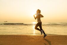 Woman Running On Beach At Sunrise Stock Images Woman Running On Beach At Sunrise Stock Images
