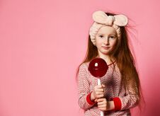 Funny Child With Candy Lollipop, Happy Little Girl Eating Big Sugar Lollipop Royalty Free Stock Photography