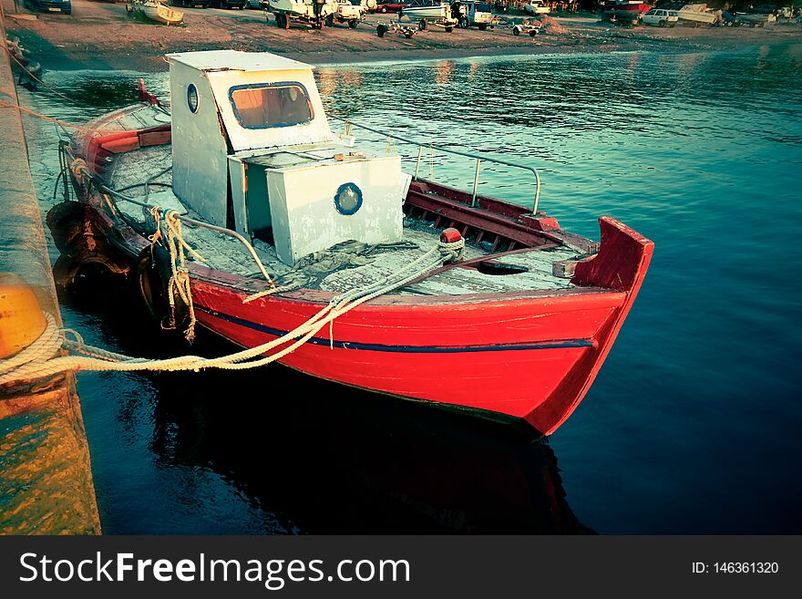 Small sea fishing boat anchored at harbor - Image. Small sea fishing boat anchored at harbor - Image