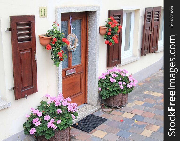 Front door with flowers