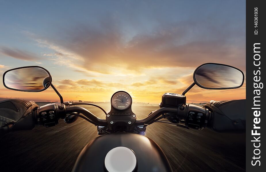 POV of motorcycle driver with handlebars