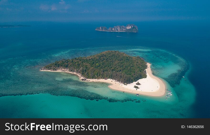 Aerial drone view of beautiful tropical Bamboo Island white beach with boats in Thailand. Aerial drone view of beautiful tropical Bamboo Island white beach with boats in Thailand