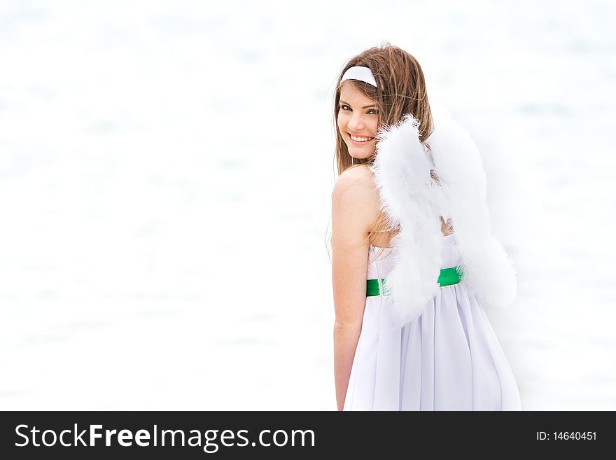 Young angel-girl on natural background