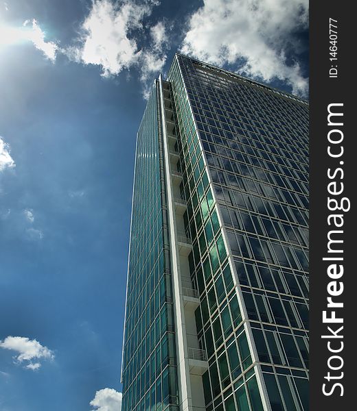 Down view on modern building with blue sky and clouds. Down view on modern building with blue sky and clouds