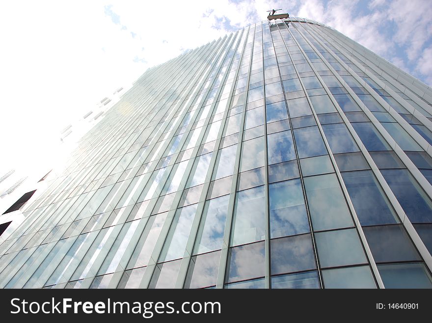 Architectural details of a modern glass wall of an office building. Architectural details of a modern glass wall of an office building