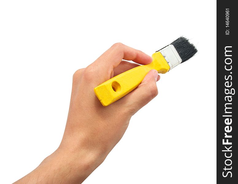 Hand with yellow brush. Element of design.