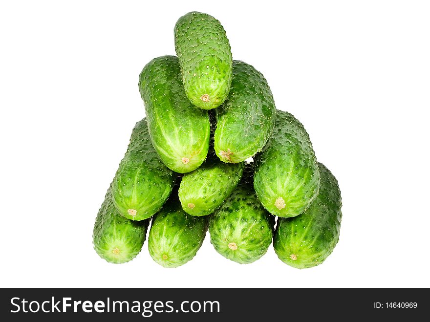 Pile of fresh cucumbers isolated on white