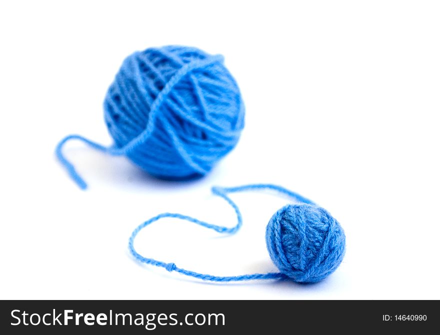 Ball of knitting yarn on a white background